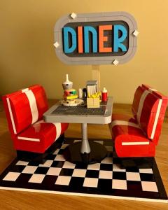 LEGO MOC - Retro Diner, designed by Zachary Steinman, realistic and artistic restaurant scene from the 50s in LEGO bricks